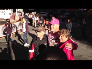 WWE John Cena posing with fans in Times Square in New York