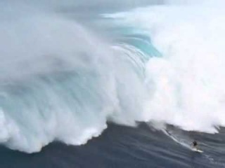 Surfing a Tsunami - Man surfs 65' killer wave - has the ride of his life survives JAWS MAUI