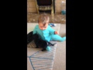 cute Baby laughing at pug puppies