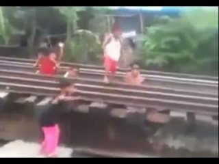 LiveLeak - Children Playing On Train Tracks over Rickety Bridge
