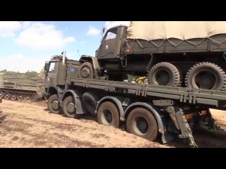 Soviet artillery tractor ATS-59 pulls army truck Tatra and Praga V3S -