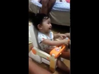 Cute baby laughing while playing