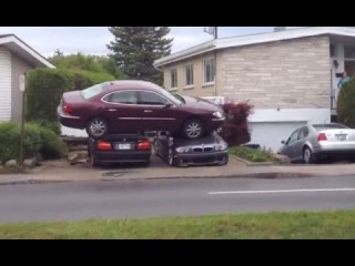 LiveLeak - Aftermath of car that went airborne landing on 2 parked BMWs