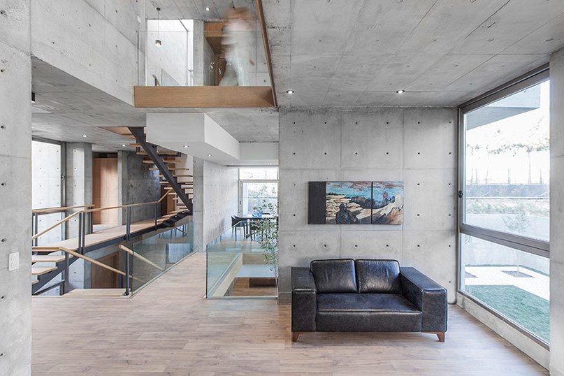 bracket design studio completes concrete villa 131