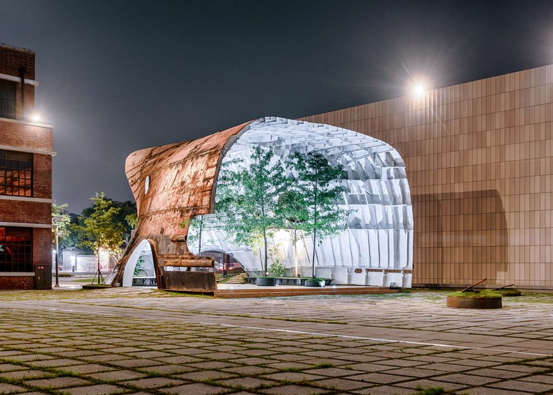 Rusty ship transformed into cavernous pavilion for