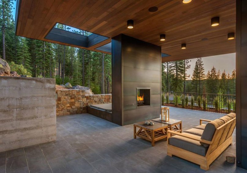 Californian home by Blaze Makoid steps down a forested hillside