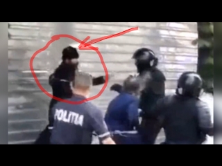 Батюшка бьёт ОМОН защищающий гей-парад в Кишинёве