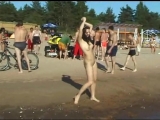 Slim_teen_with_perky_boobs_naked_at_a_nudist_beach_-480p