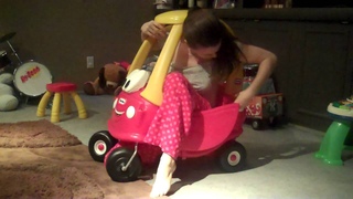 Mom tries to get in baby's toy car