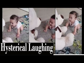 cute baby laughing hysterically at white toy bear | Cutiepiebaby