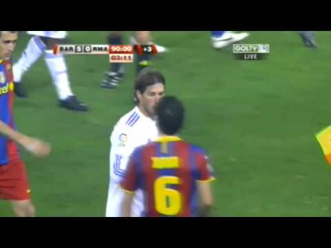 10. Ramos punches Puyol Xavi