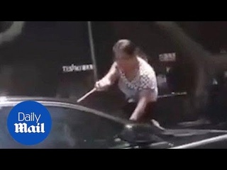 Furious wife jumps onto bonnet of unfaithful hubby's car - Daily Mail