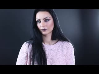Black hair, grey eyes, and a cork cigarette smoked with style