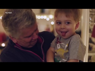 Boy controlling a street of Christmas lights with his heartbeat